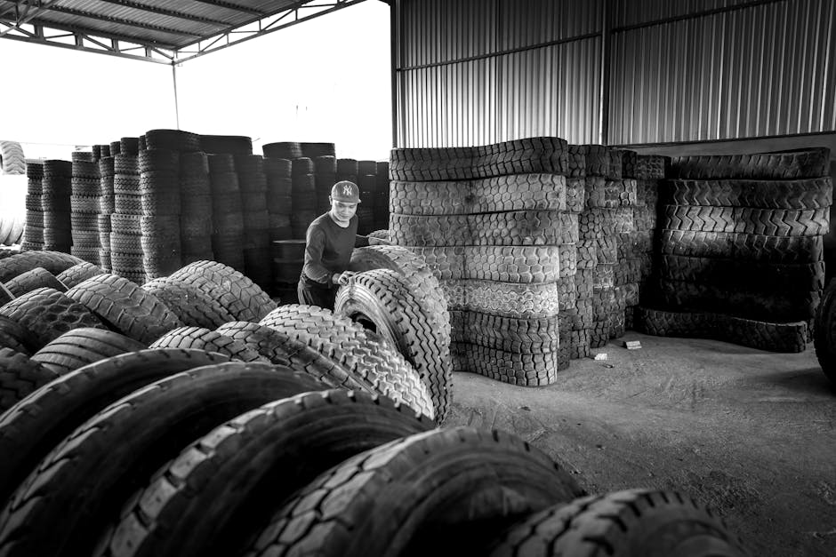 Winter and summer tires stacked safely in a storage warehouse
